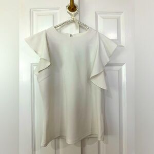 White work top with ruffled short sleeve accent. Size large.